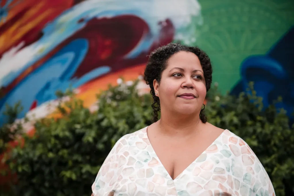 a headshot of a woman against a graffiti wall. D:\Dropbox\Dropbox\Hammer & PIxel\photo services\Headshots